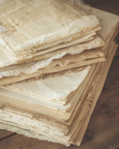 tea dyed vintage journal papers drying on rustic wooden surfa dd0408e8 8f71 45ee 8beb 34a2a7844499 3